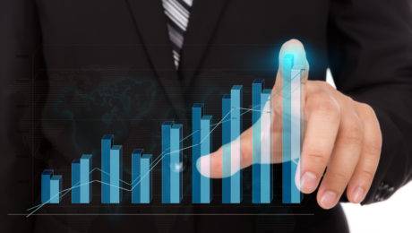 Business man pressing high tech type of modern graph on a virtua